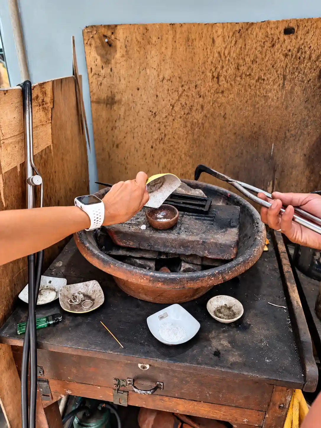 Guest polishing handmade silver jewelry in the Ubud workshop
