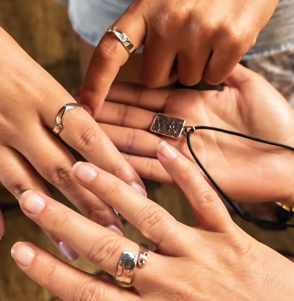 Guest showing handmade silver rings created during a Ubud jewelry workshop
